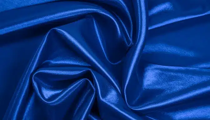 glossy blue satin fabric close up