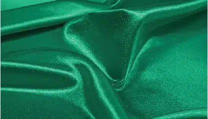 smooth green satin fabric with elegant folds and highlights