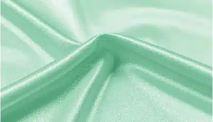 smooth mint green satin fabric texture with elegant folds