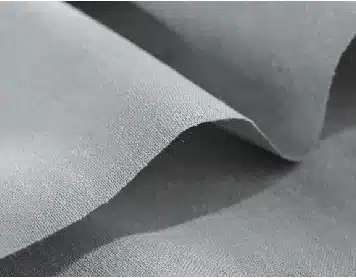 soft gray fabric texture with subtle folds and closeup detail