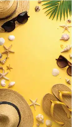 summer vacation essentials flat lay on yellow background